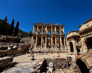 Library of Celsus facade in Ephesus, crowded with visitors.