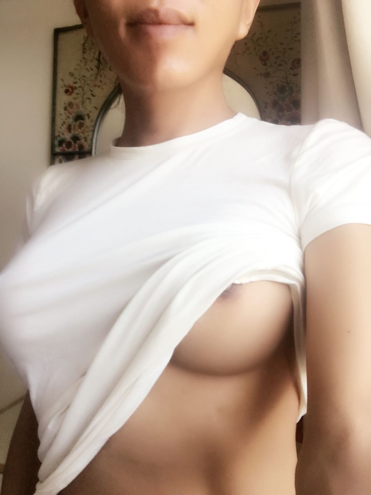 Trans escort in a basic white t-shirt